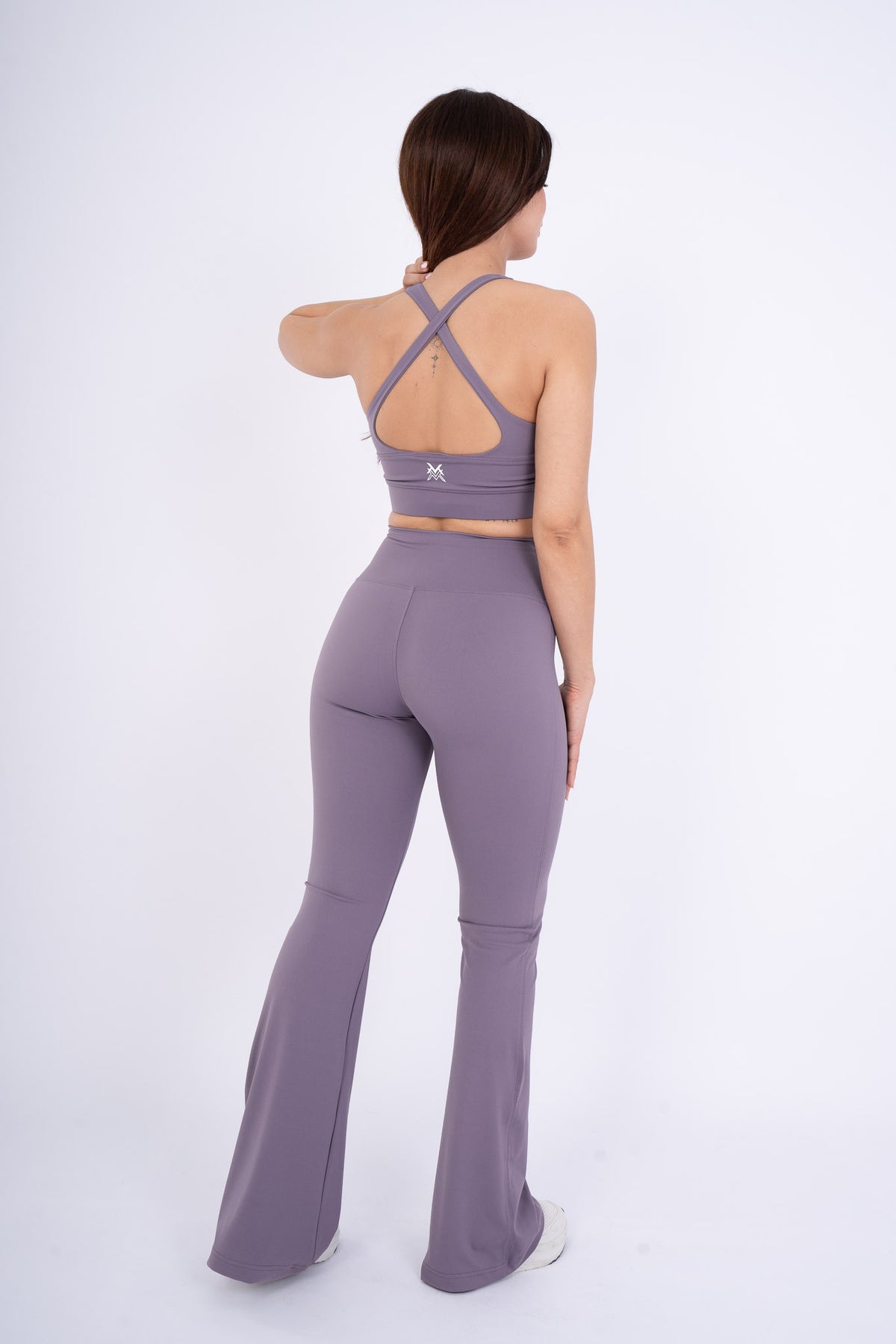 Women's VAN MILE Reborn Sports Bra in Purple – back view, shown with matching flared leggings