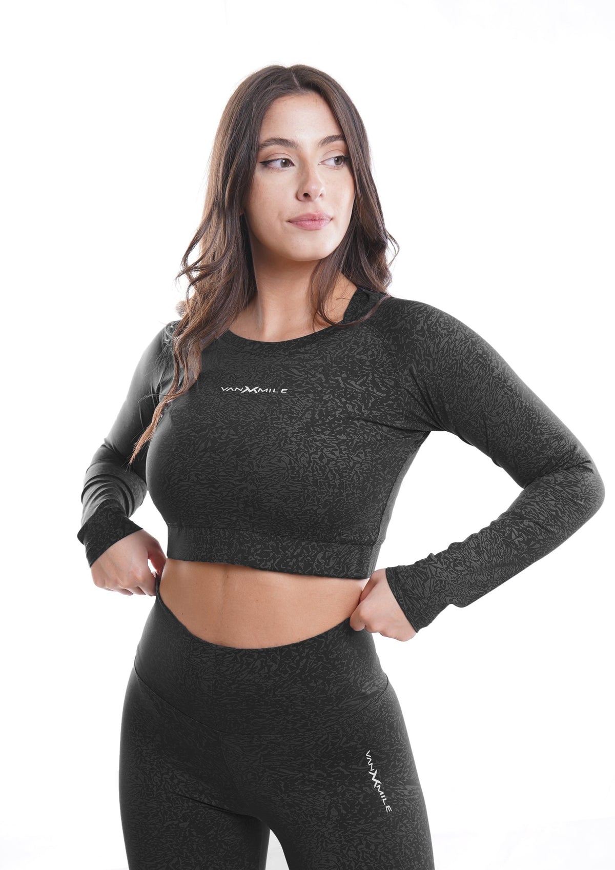 Women's VAN MILE Journey Cropped Long Sleeve Shirt in Black – angled front view, shown with matching leggings