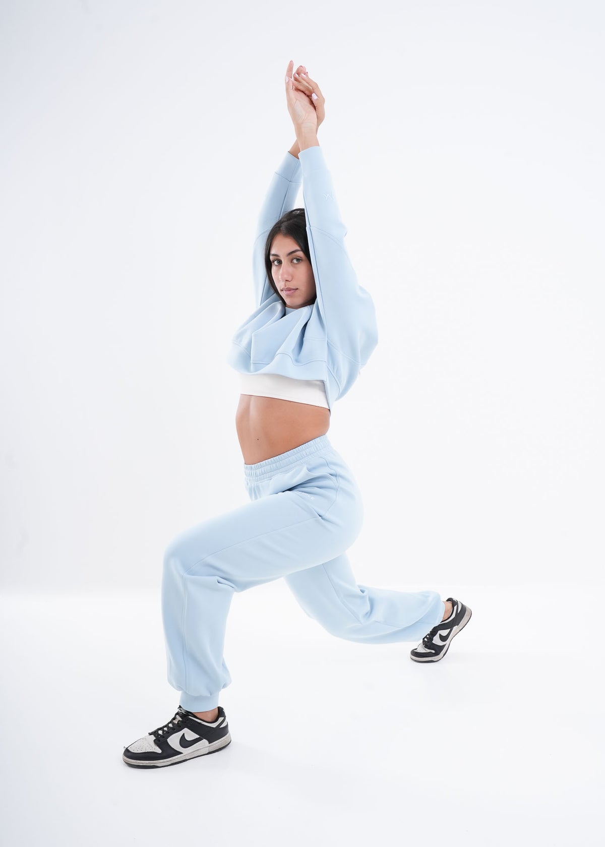 Women's VAN MILE VNML Two-Piece Crop Set in Baby Blue – side view, lunge pose
