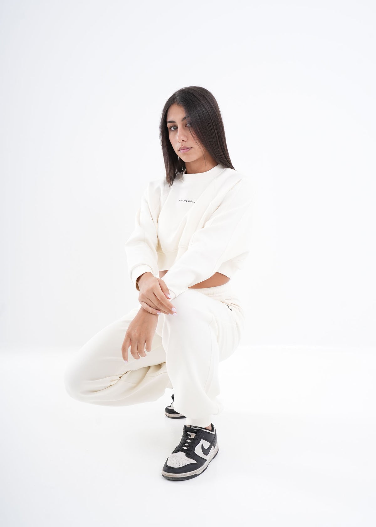 Women's VAN MILE VNML Two-Piece Crop Set in Off White – full-length, crouching pose