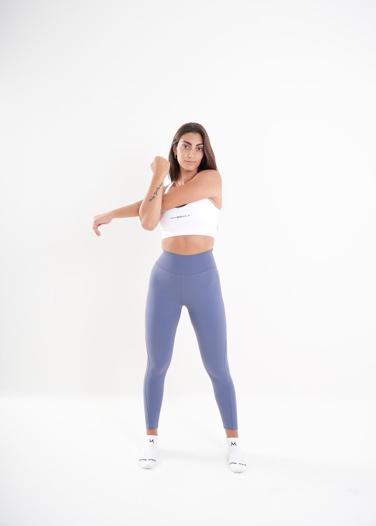 Women's VAN MILE AURORA Leggings in Baby Blue – arm stretch pose