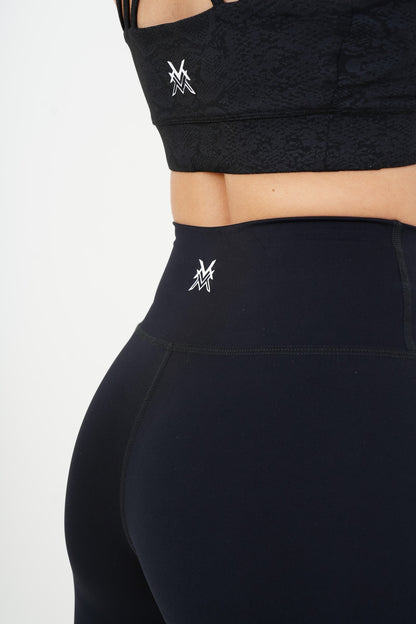 Women's VAN MILE AURORA Capri Leggings in Black – back waistband logo detail