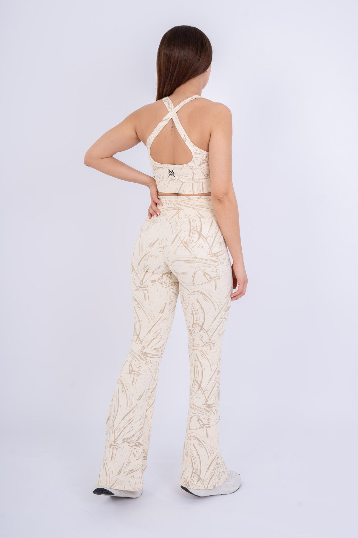 Women's VAN MILE Ignite Sports Bra in Beige Printed – back view, shown with matching flared leggings