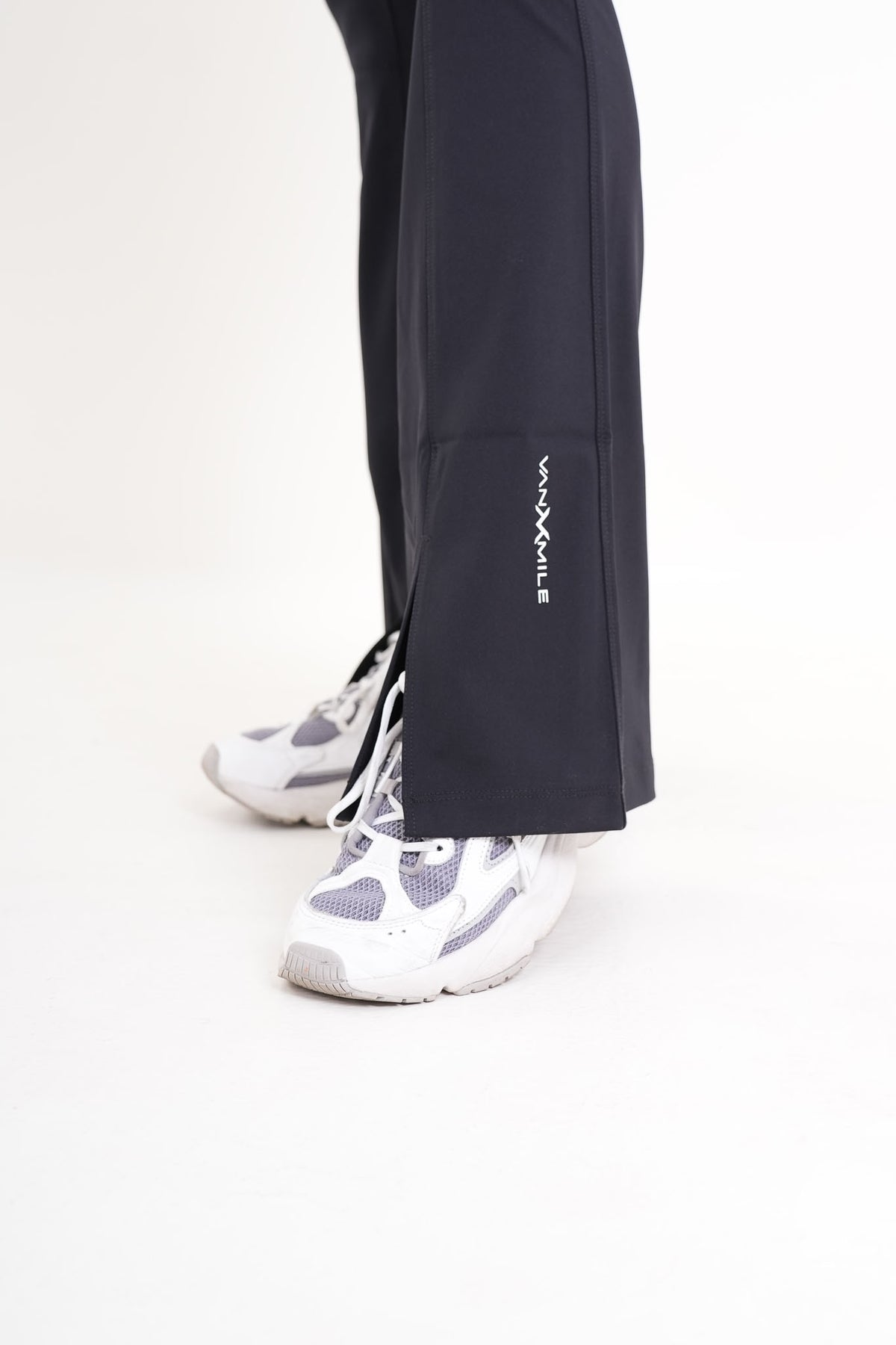 Women's VAN MILE AURORA Flared Leggings in Black – split hem and logo detail