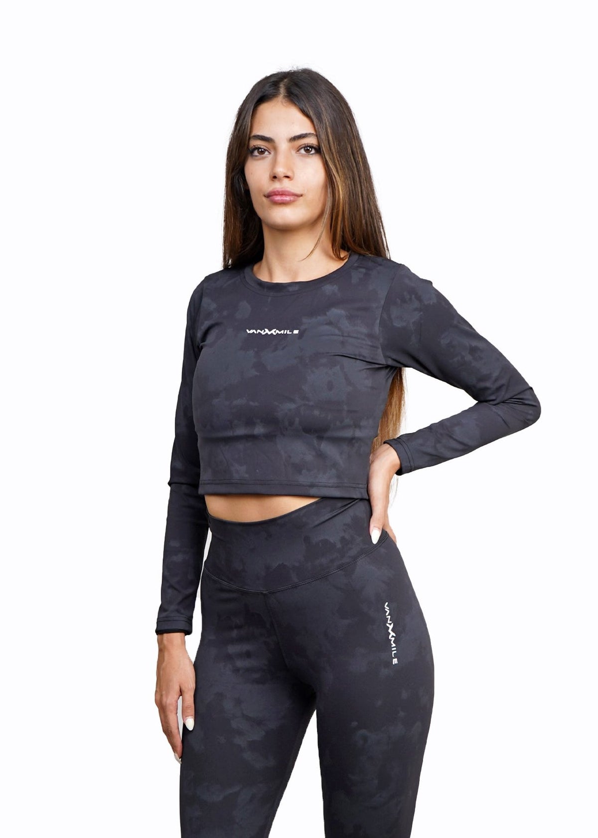 Women's VAN MILE Mist Crop Top Long Sleeve in Black – front view, shown with matching leggings