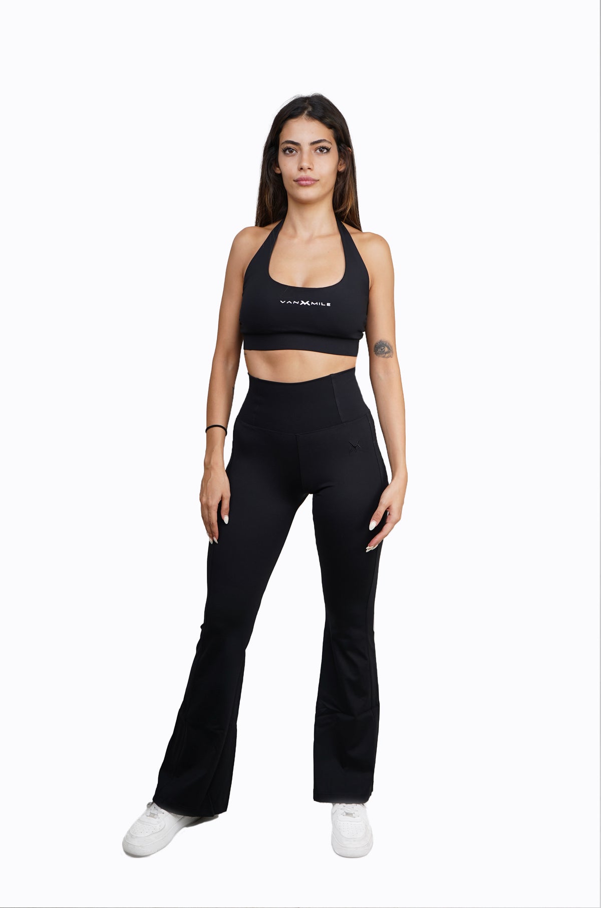 Women's VAN MILE Sports Bra in Black – full outfit, shown with matching flared leggings