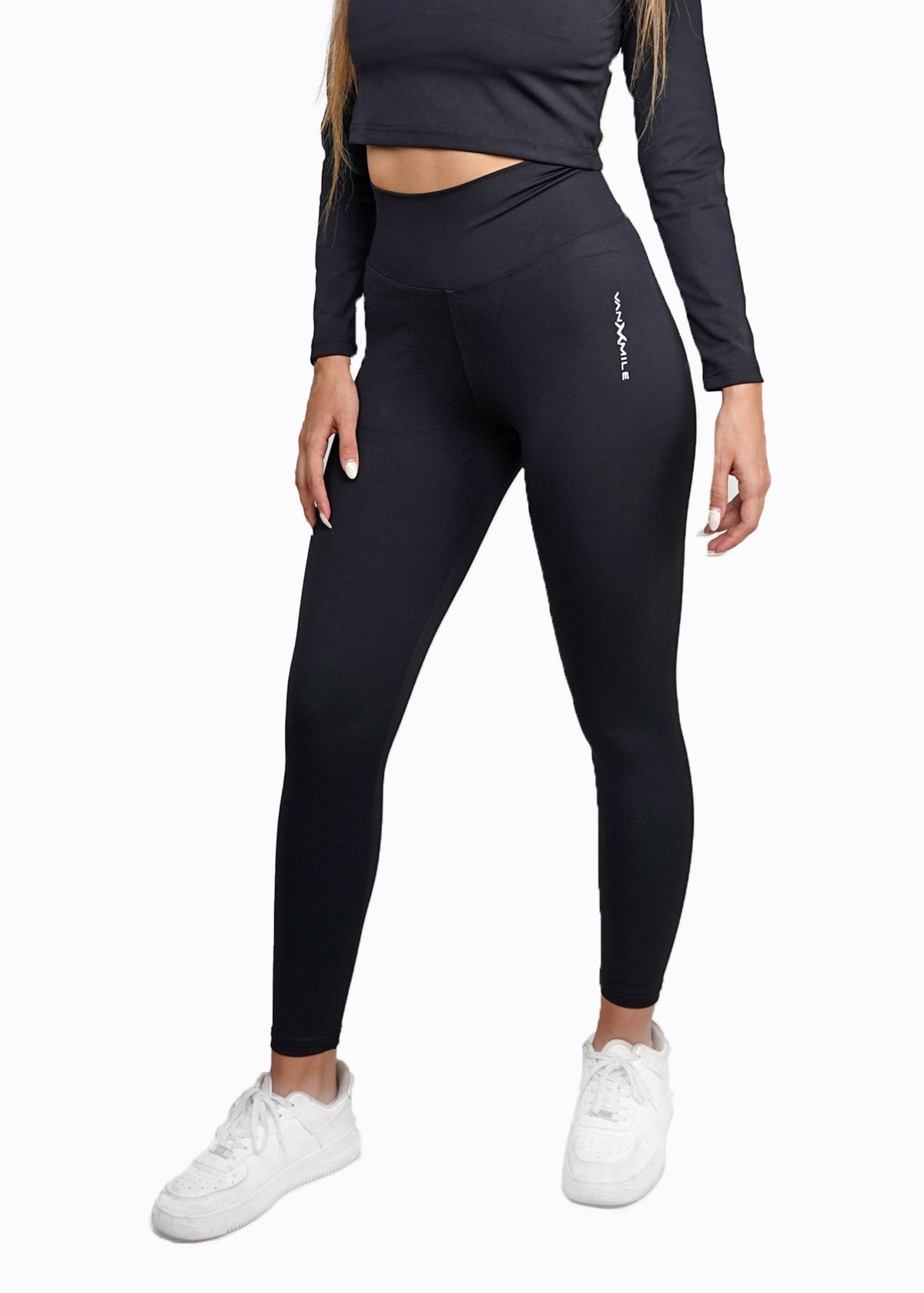 Women's VAN MILE Core Leggings in Black – front view, shown with matching long-sleeve crop top