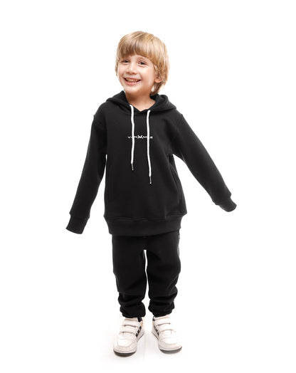 Kids' VAN MILE Everyday Kids Tracksuit in Black – front view, worn by a boy, arms out