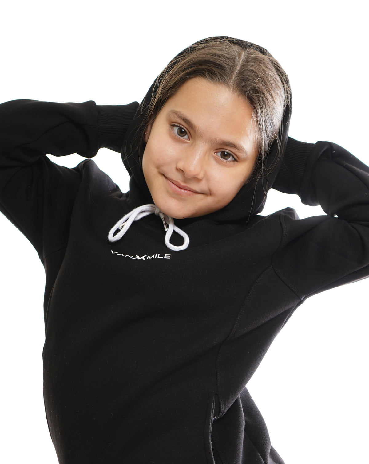 Kids' VAN MILE Everyday Kids Tracksuit in Black – front view, worn by a girl, hood up