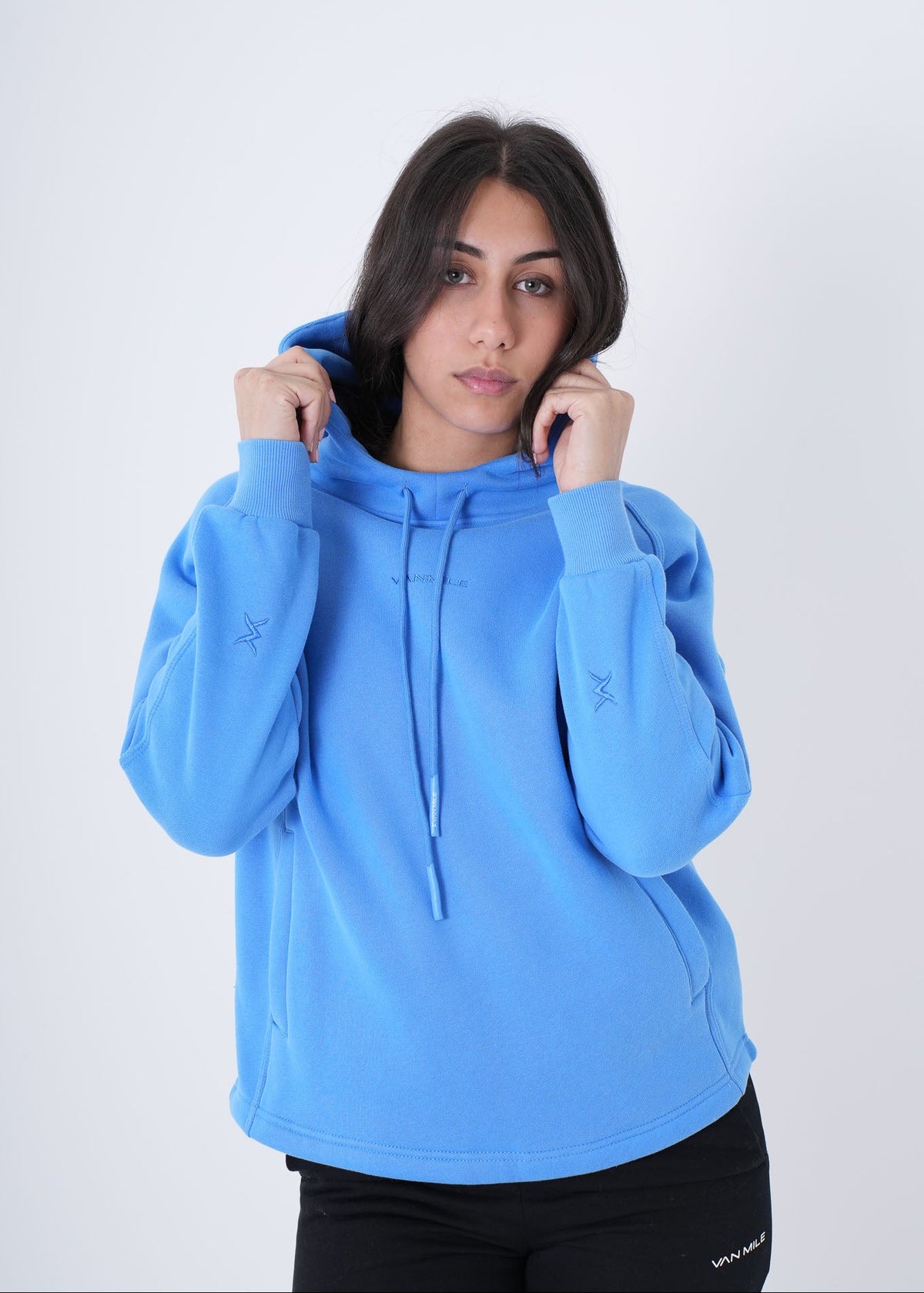 Women's VAN MILE VNML Hoodie in Sky Blue – front view, holding the hood