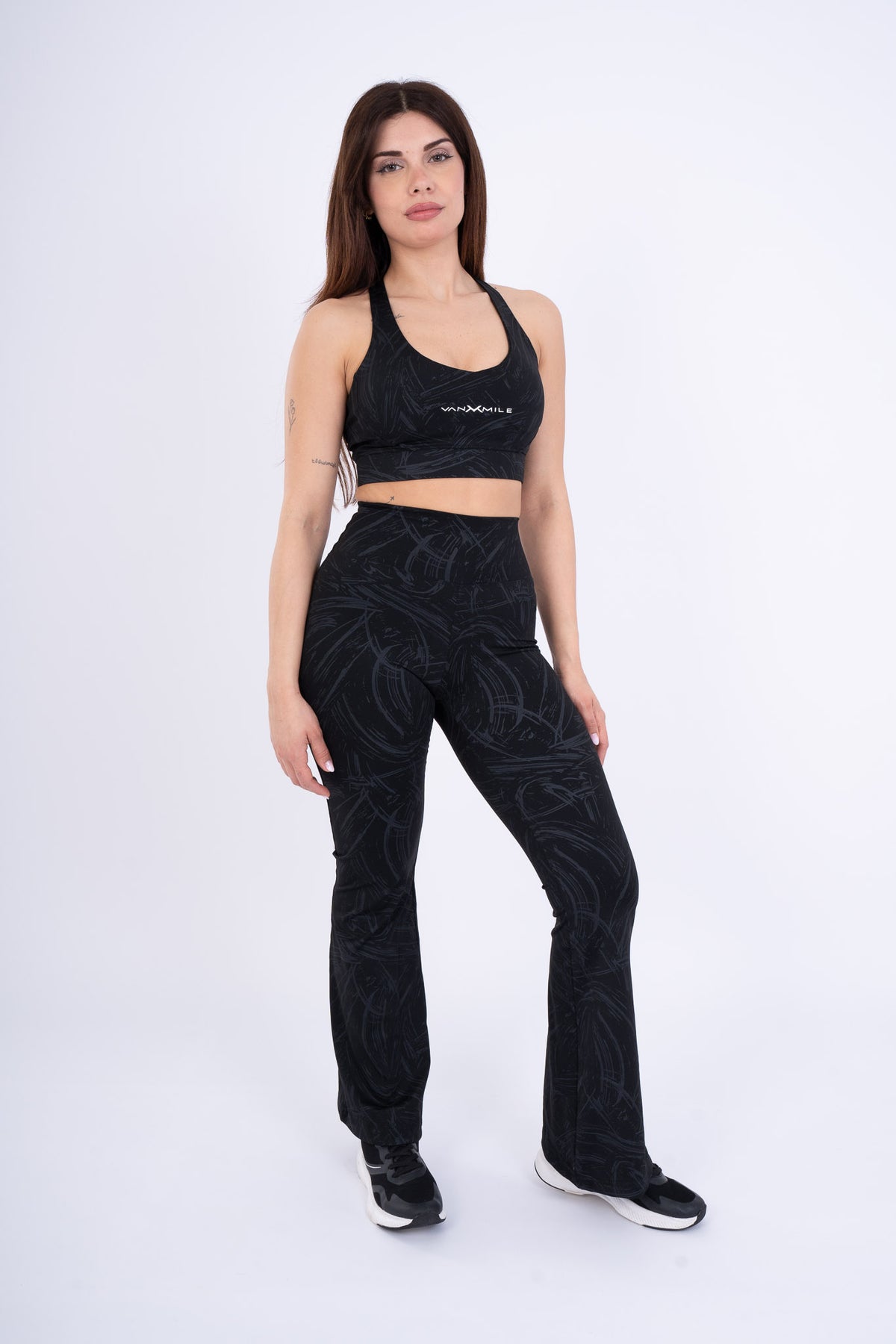 Women's VAN MILE Ignite Sports Bra in Black Printed – front view, shown with matching flared leggings