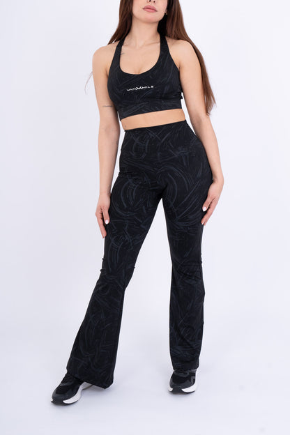 Women's VAN MILE Ignite Sports Bra in Black Printed – front view, shown with matching flared leggings