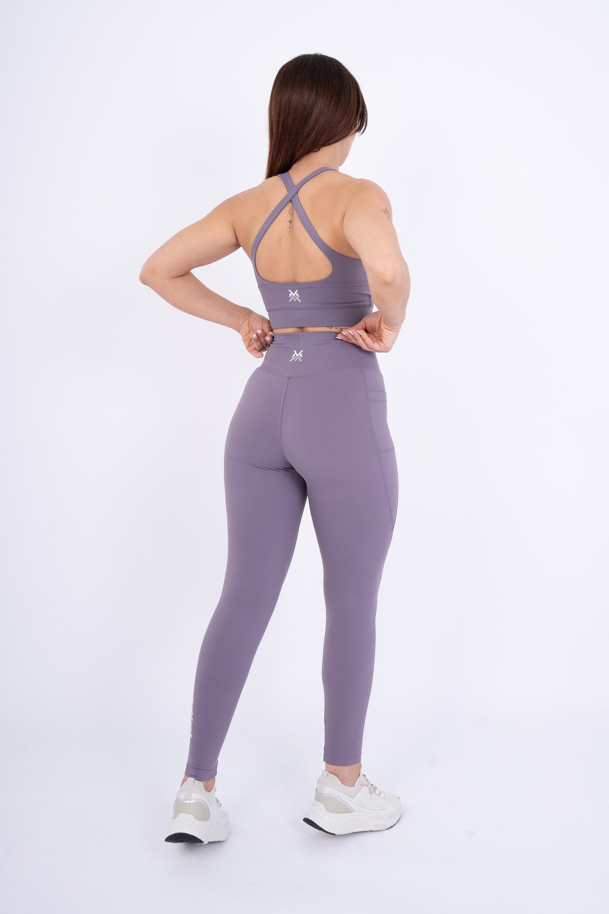 Women's VAN MILE Reborn Leggings in Purple – back view, shown with matching sports bra