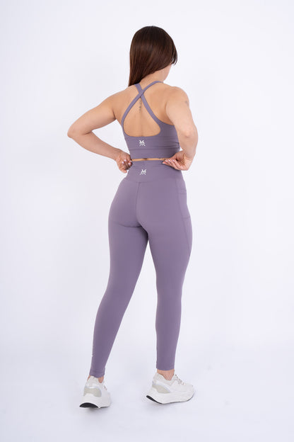 Women's VAN MILE Reborn Leggings in Purple – back view, shown with matching sports bra