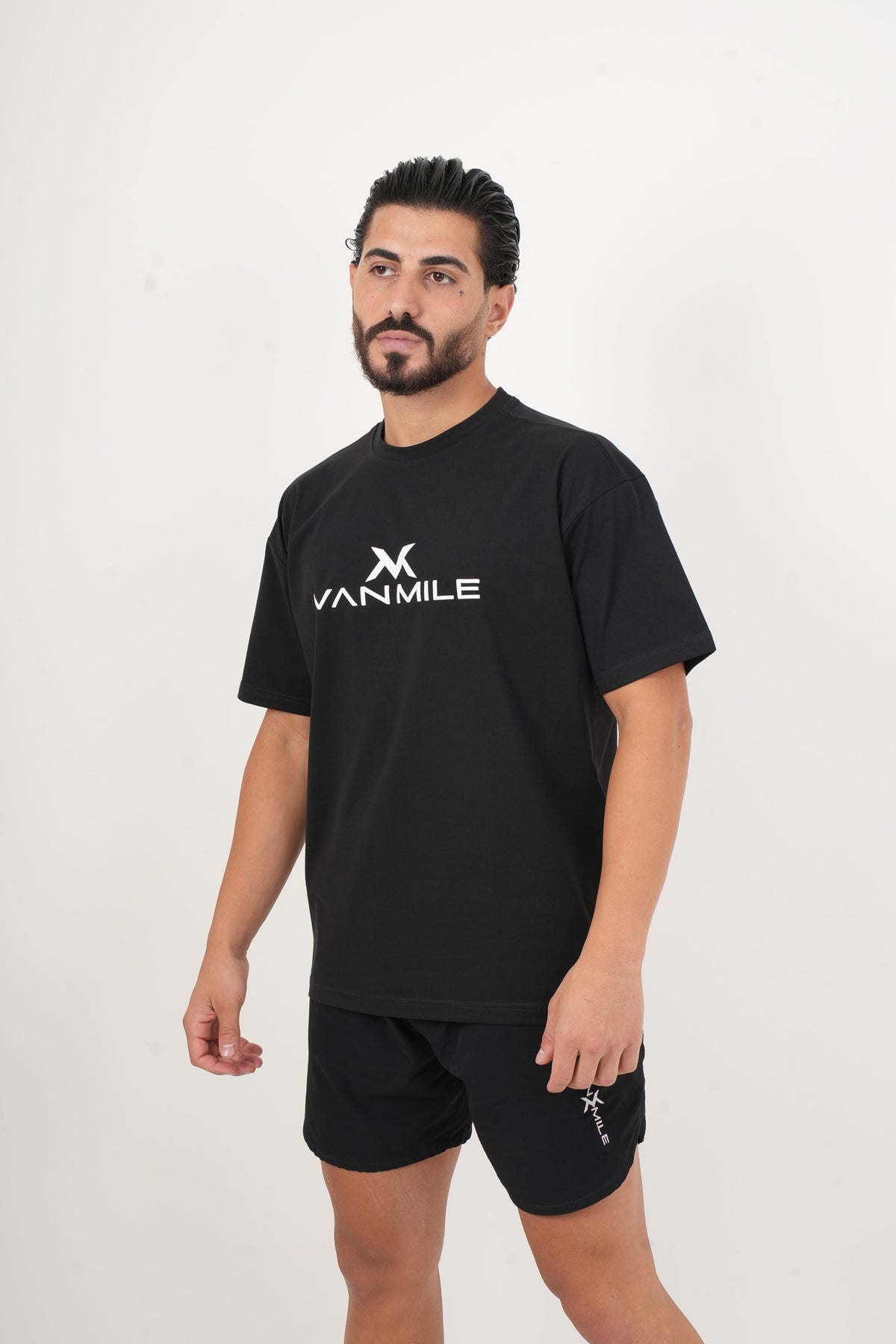 Men's VAN MILE IMPACT Oversized T-Shirt in Black – three-quarter front view