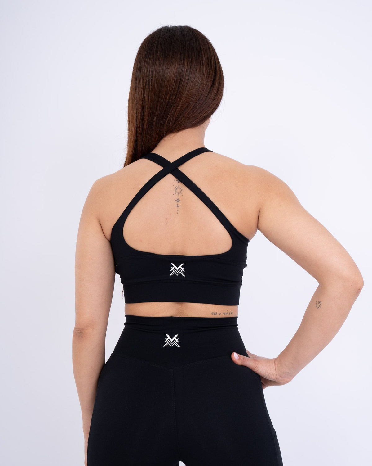 Women's VAN MILE Reborn Sports Bra in Black – back view showing crossed straps