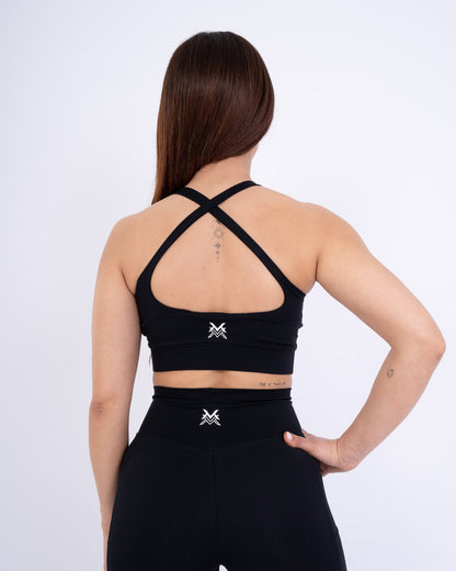 Women's VAN MILE Reborn Sports Bra in Black – back view showing crossed straps