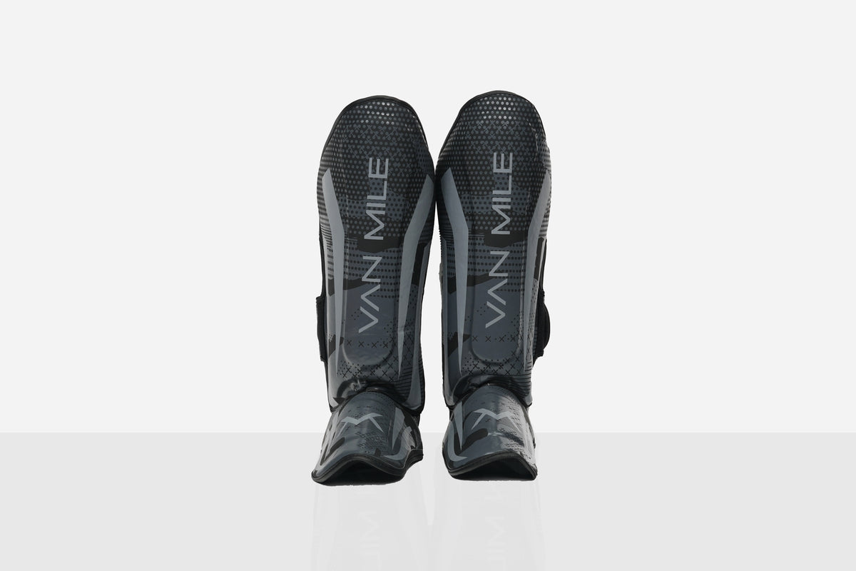 VAN MILE PU 4.0 Shin Guards in Black & Grey – pair shown, front view