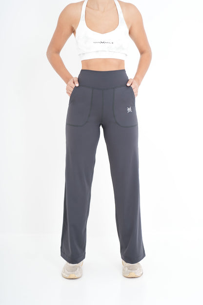Women's VAN MILE PULSE Flared Leggings in Slate Grey – front view, hands in pockets