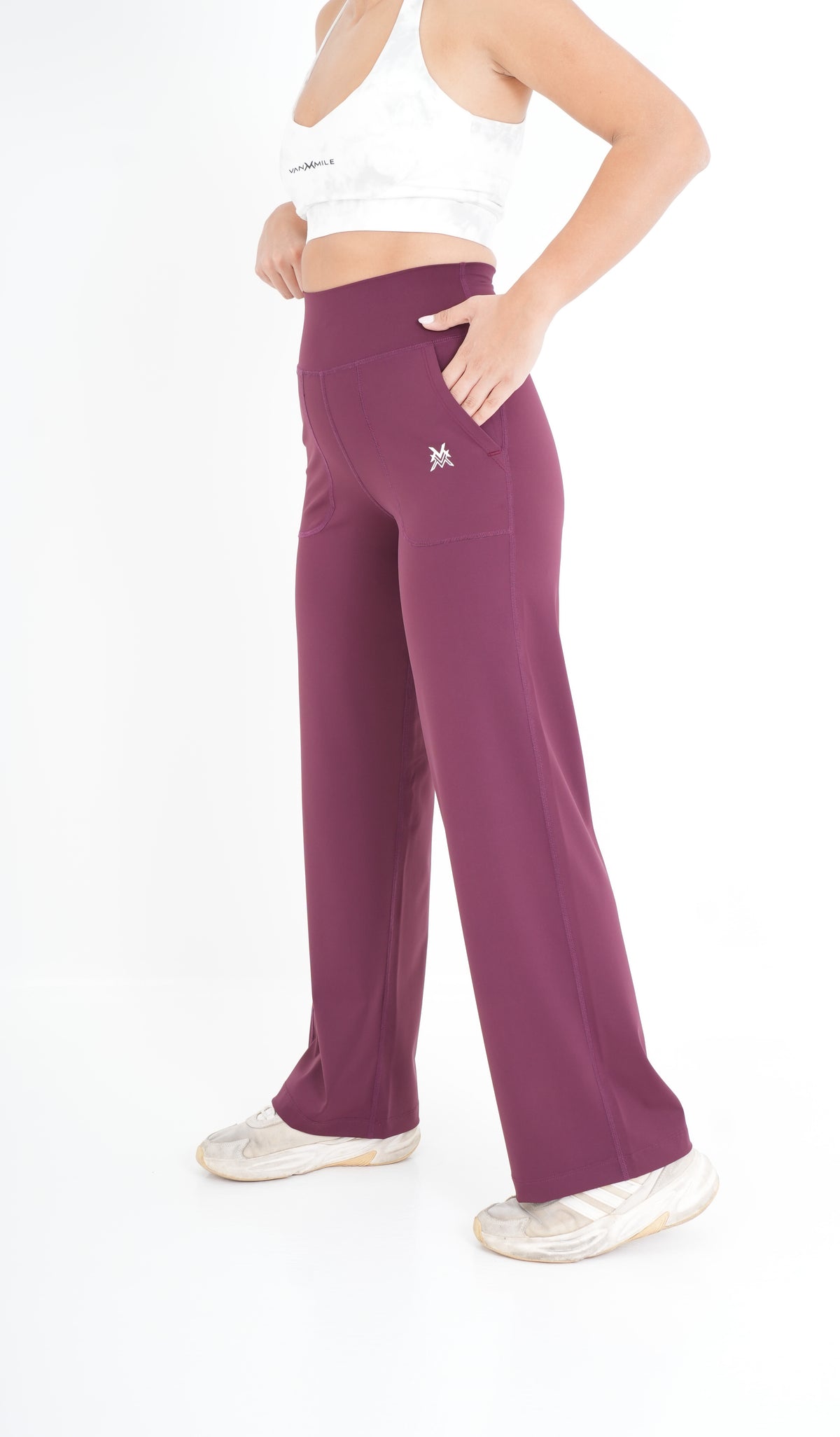 Women's VAN MILE PULSE Flared Leggings in Ruby – side view, hand in pocket