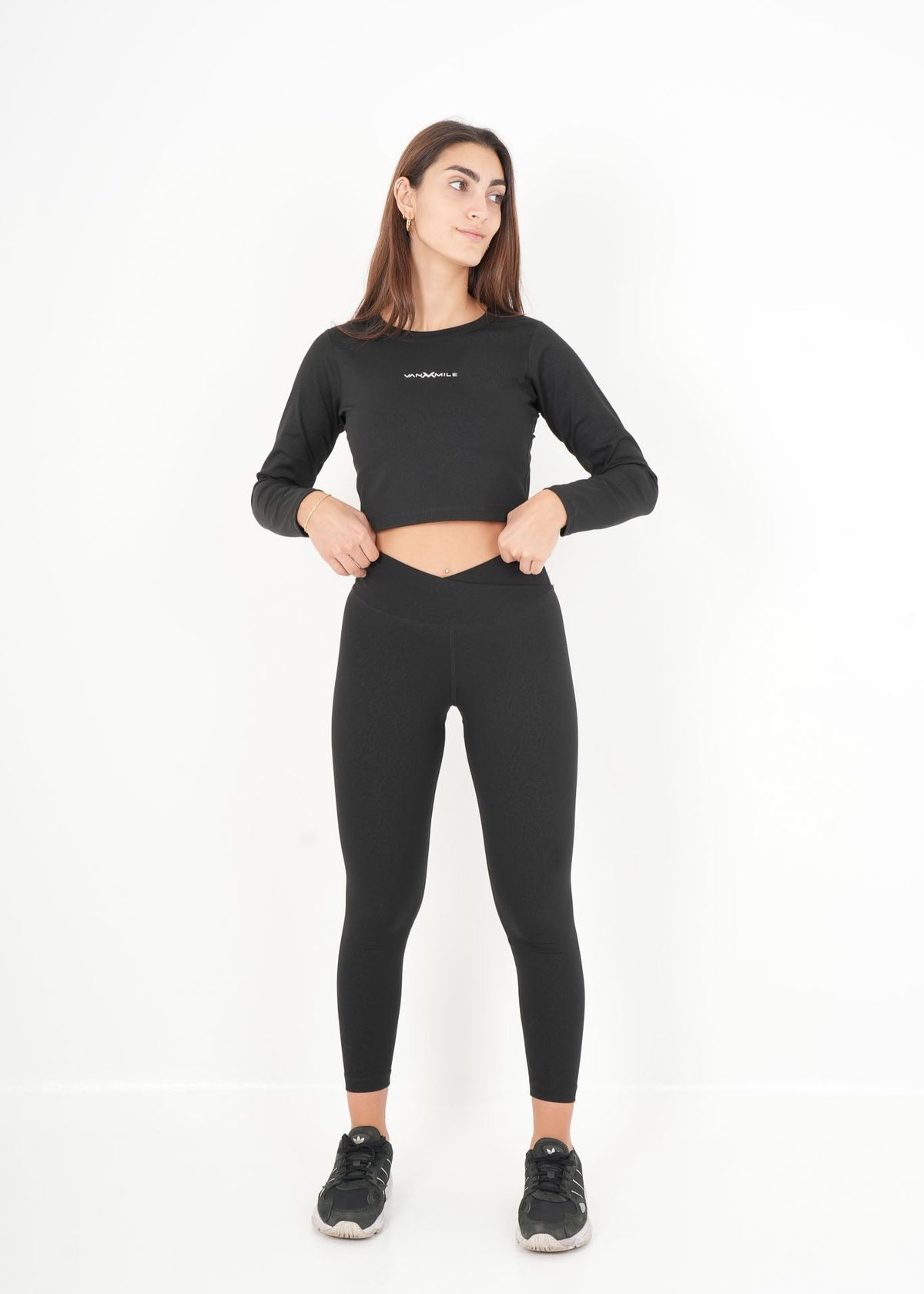 Women's VAN MILE ACTV Two-Piece Cropped Set in Black – full-length front view, hands at waistband