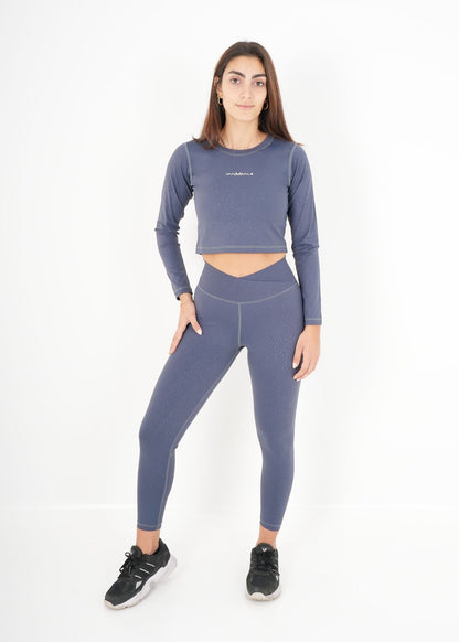 Women's VAN MILE ACTV Two-Piece Cropped Set in Baby Blue – full-length front view, hand on hip