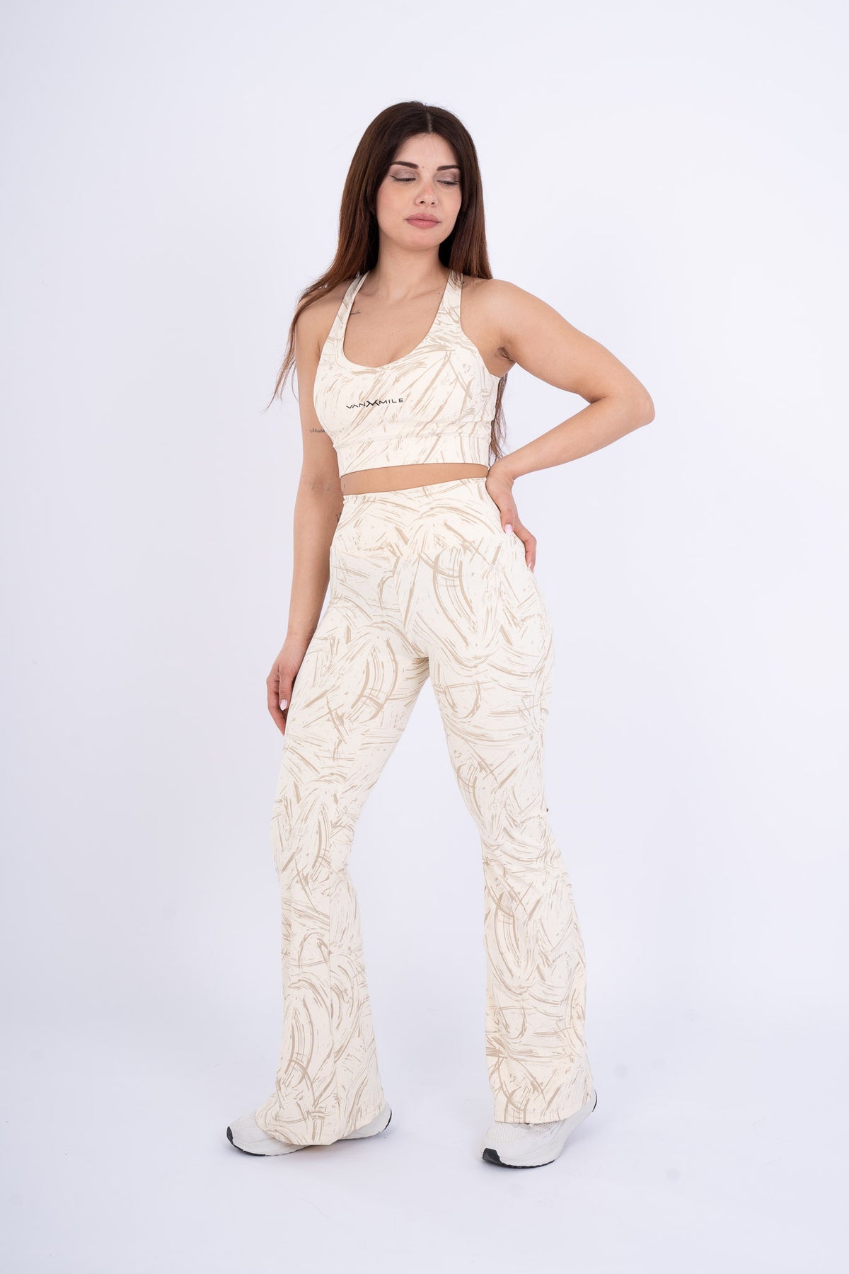 Women's VAN MILE Ignite Sports Bra in Beige Printed – front view, shown with matching flared leggings
