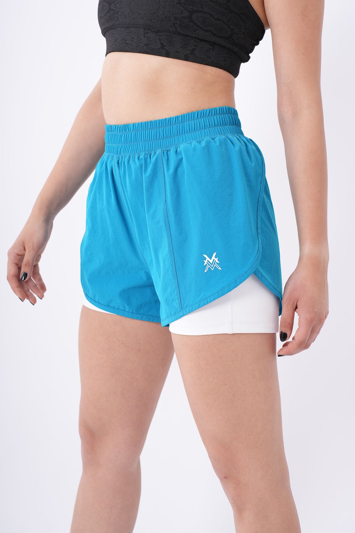 Women's VAN MILE Aurora Compression Shorts in Sky Blue – angled front view, close