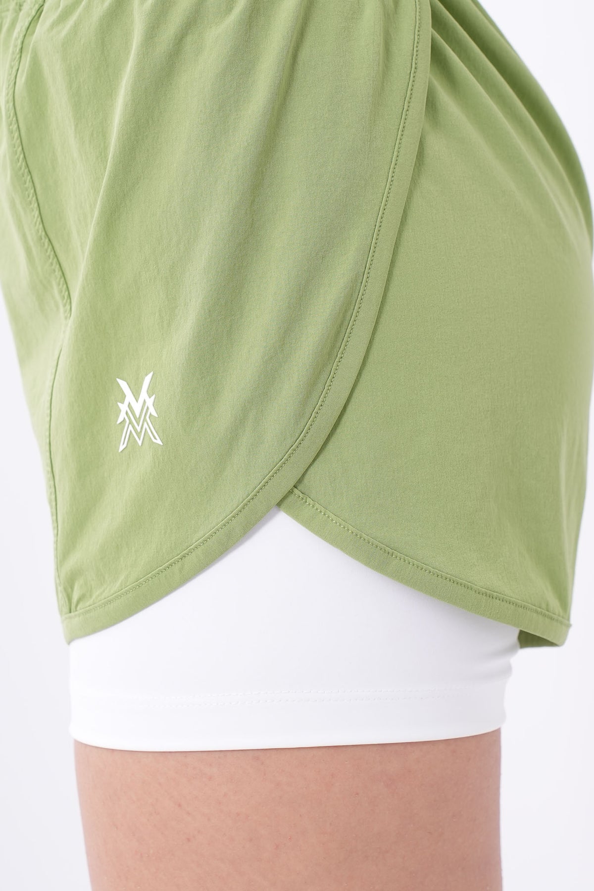 Women's VAN MILE Aurora Compression Shorts in Lime Green with White Liner – logo detail