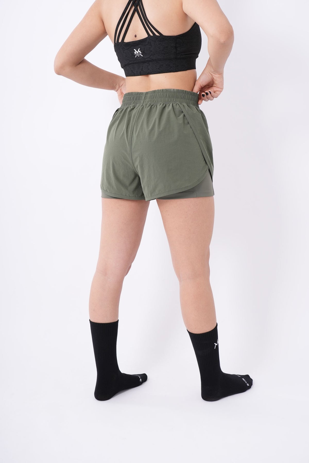 Women's VAN MILE Aurora Compression Shorts in Olive Green – back view