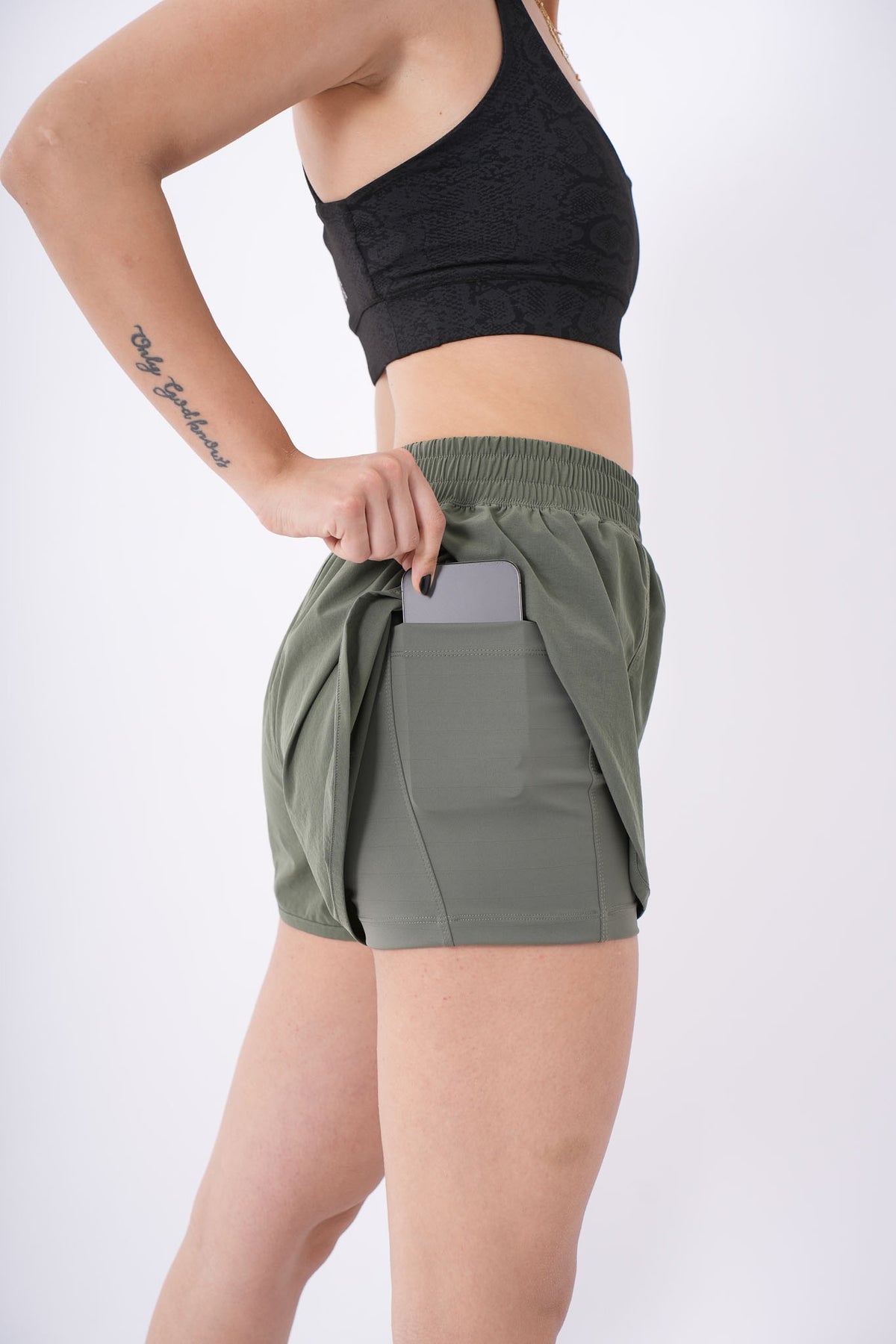 Women's VAN MILE Aurora Compression Shorts in Olive Green – liner phone pocket detail