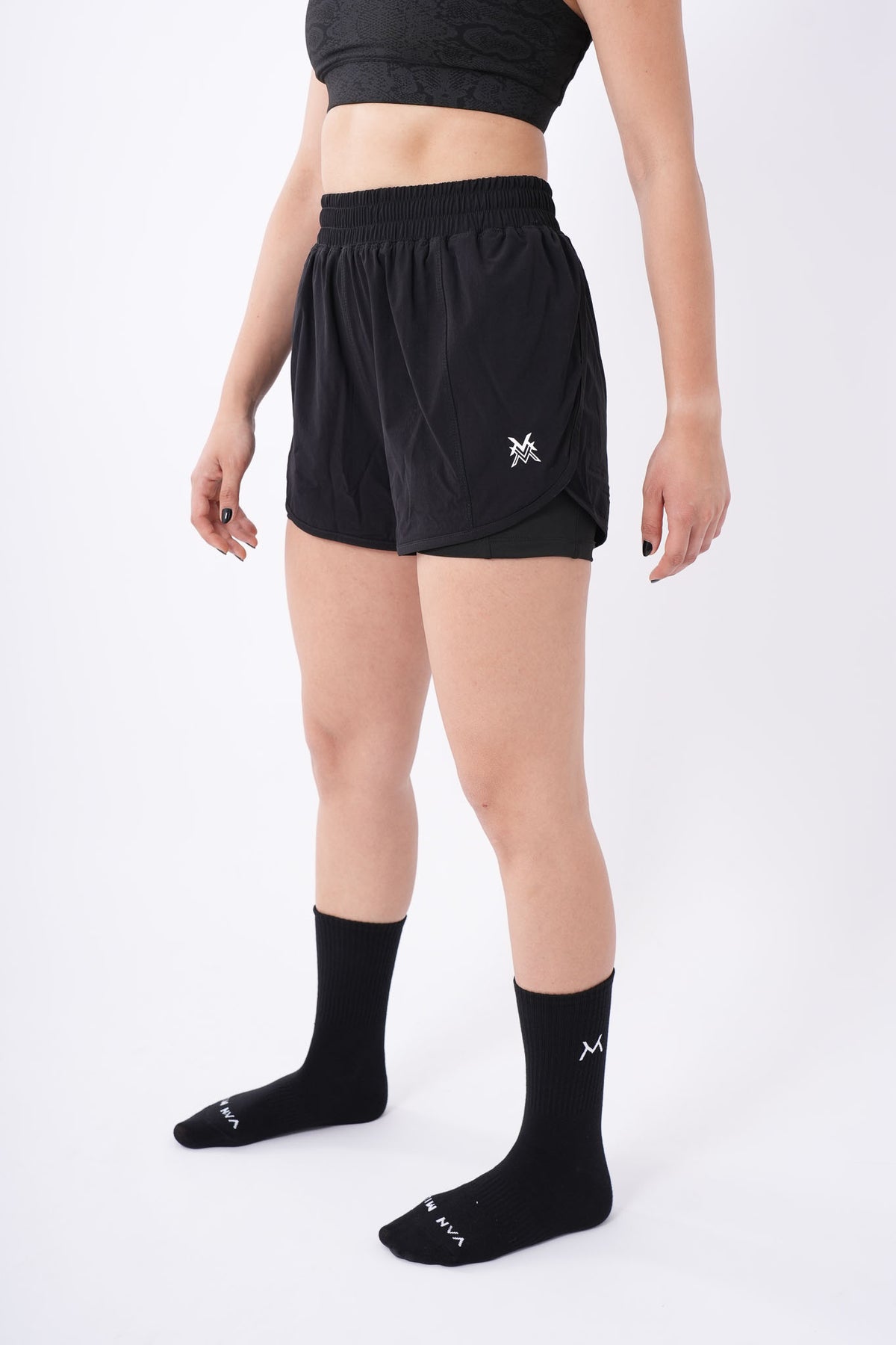 Women's VAN MILE Aurora Compression Shorts in Black – angled front view, full length