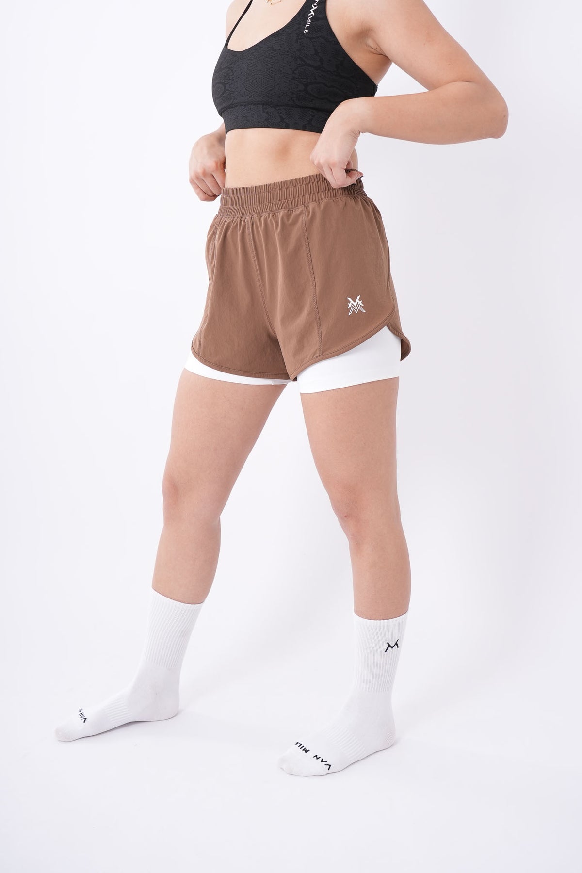 Women's VAN MILE Aurora Compression Shorts in Brown – angled front view, full length
