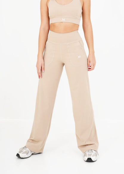 Women's VAN MILE Sculpt Flared Leggings in Beige – front view, shown with matching bra