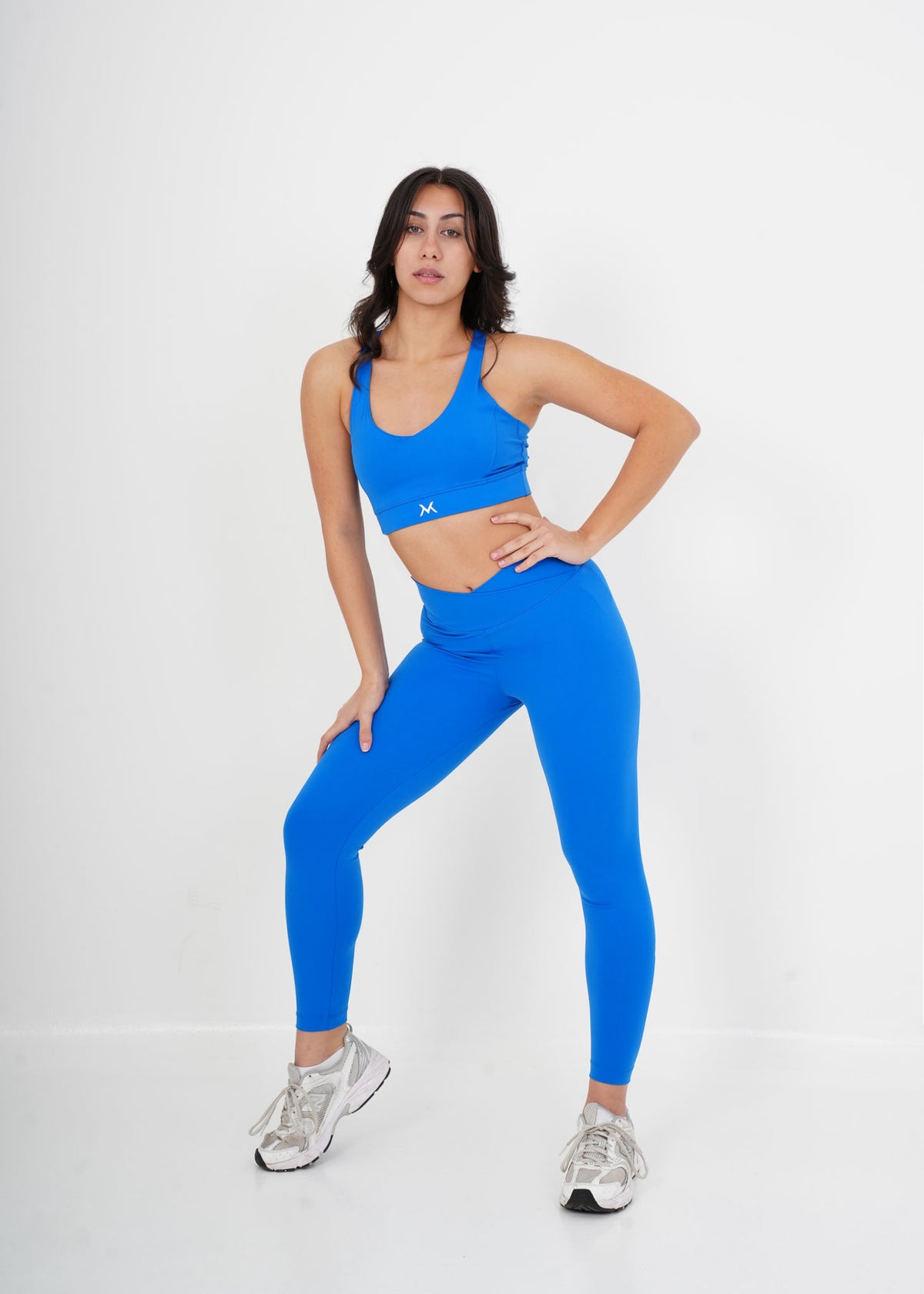 Women's VAN MILE Sculpt Sports Bra in Blue – full outfit with matching leggings, angled pose