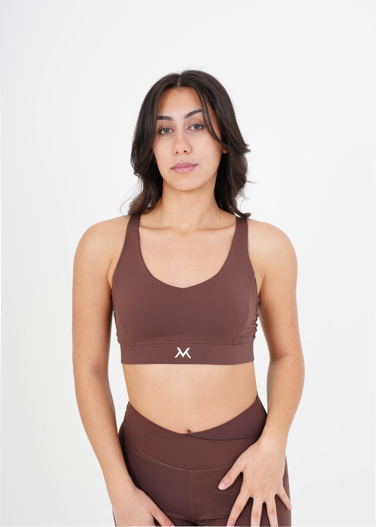 Women's VAN MILE Sculpt Sports Bra in Brown – front view, shown with matching leggings