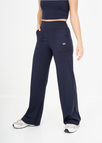 Women's VAN MILE Sculpt Flared Leggings in Navy – front view, shown with matching top