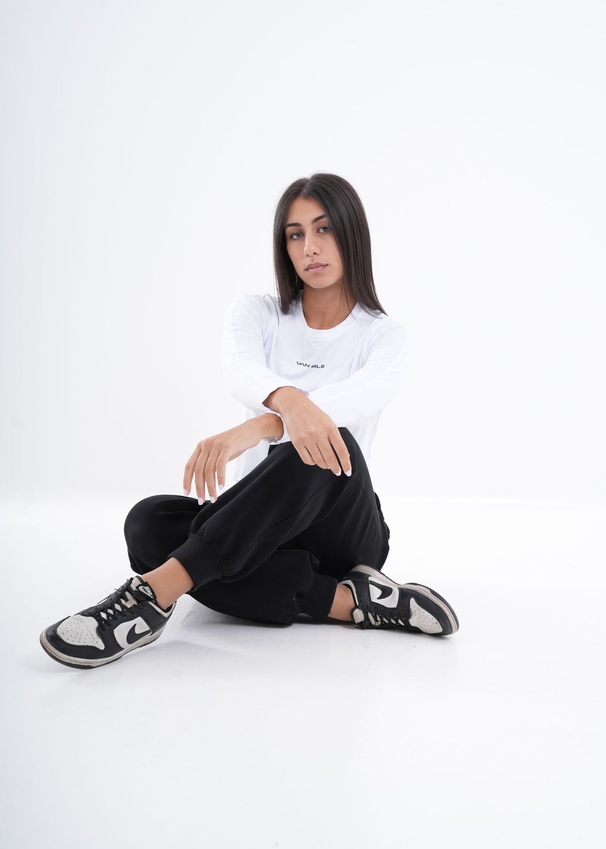 Women's VAN MILE VNML Long Sleeve Quick-Dry T-Shirt in White – seated full-length view