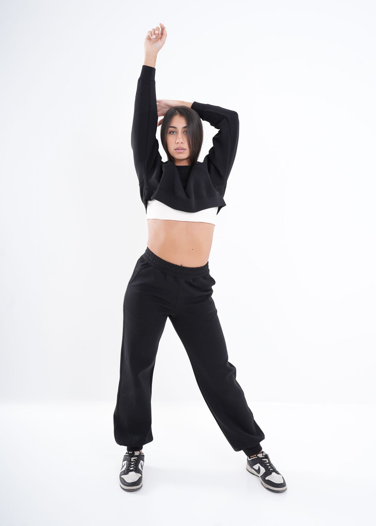 Women's VAN MILE VNML Two-Piece Crop Set in Black – full-length front view, arm raised