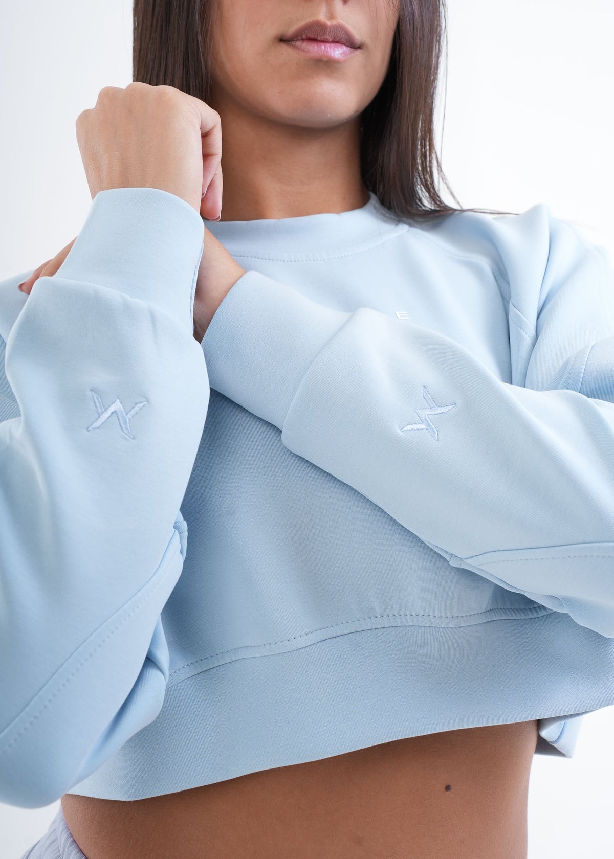 Women's VAN MILE VNML Two-Piece Crop Set in Baby Blue – sleeve logo detail