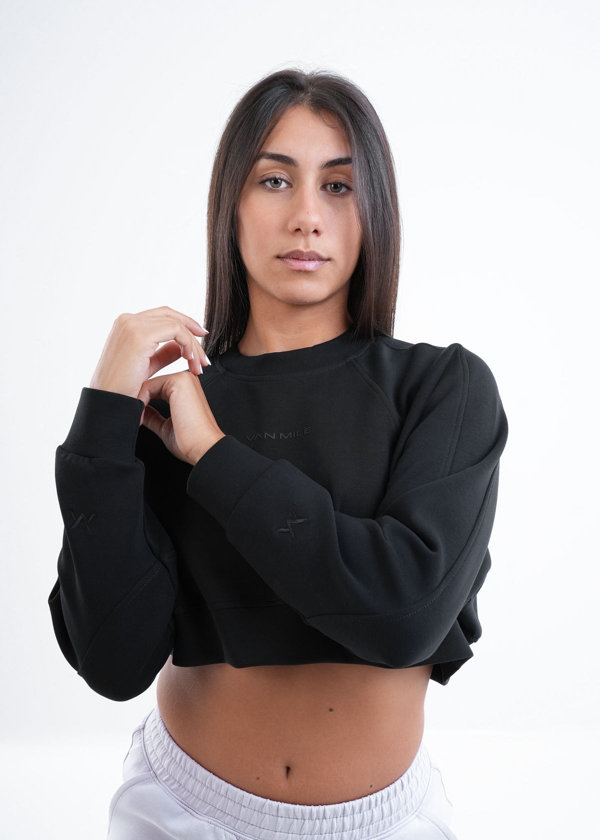 Women's VAN MILE VNML Two-Piece Crop Set in Black – cropped sweatshirt, worn with light grey joggers