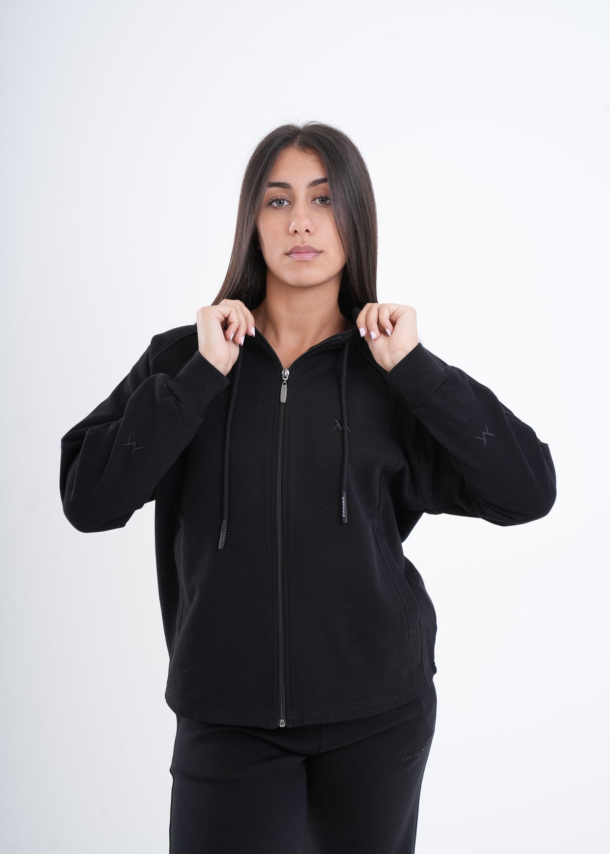 Women's VAN MILE VNML Zip Through Hoodie in Black – front view, holding the hood
