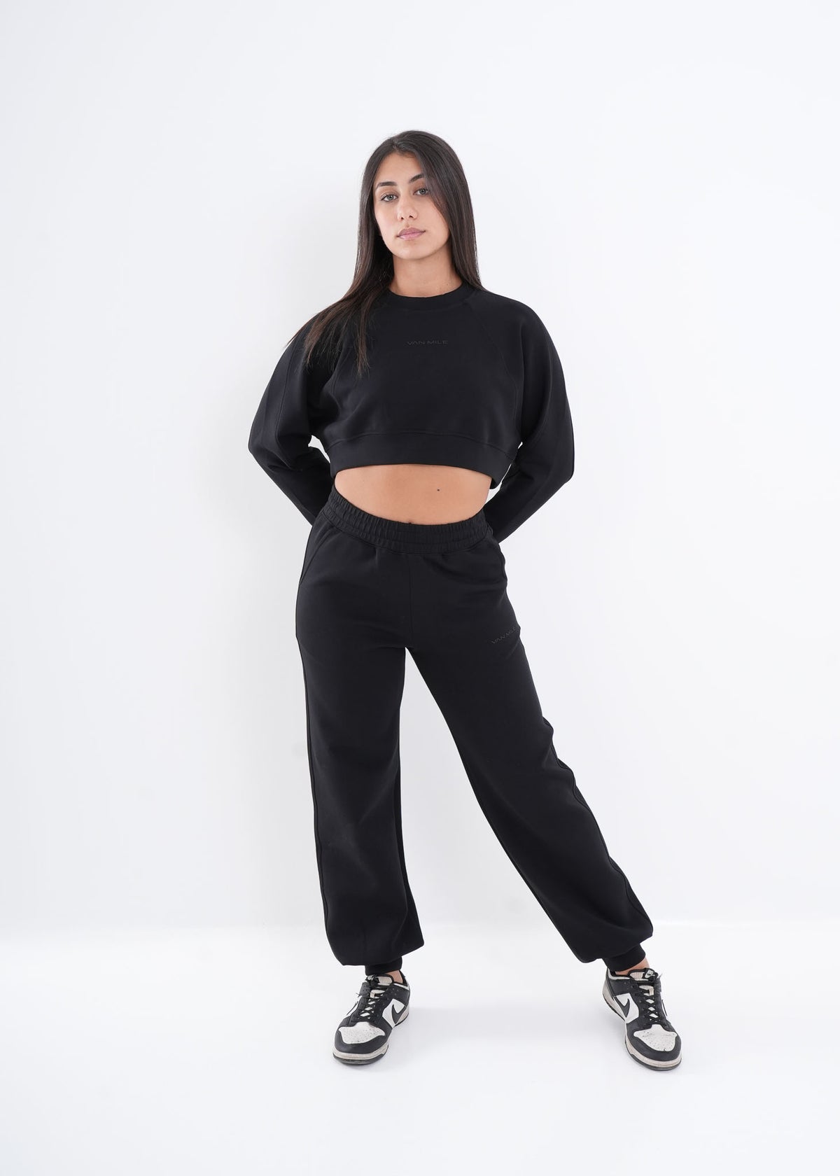 Women's VAN MILE VNML Two-Piece Crop Set in Black – full-length front view, hands behind back