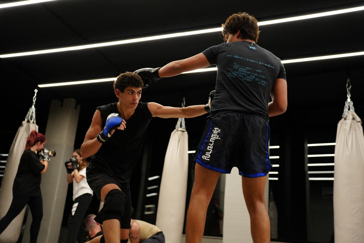 Fighters sparring in the Mat Arena at VAN MILE Gym
