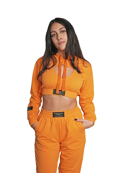Women's VAN MILE Lounge Cropped Hoodie in Melon Orange – front view, worn with matching joggers